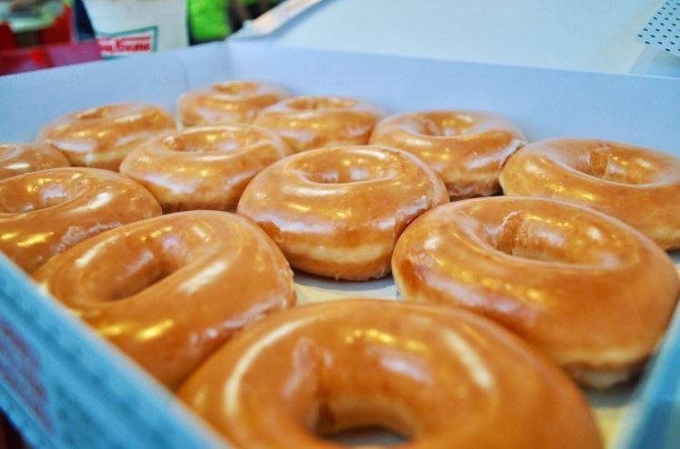 Krispy Kreme: Buy one dozen, get one for 85 cents today!