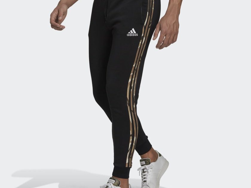 Adidas Essentials fleece camo-print pants for $32